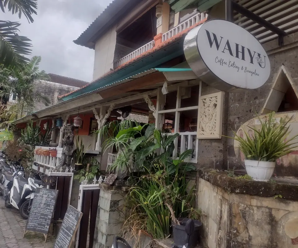 The entrance to Cafe Wahyu in Ubud, with its sign visible