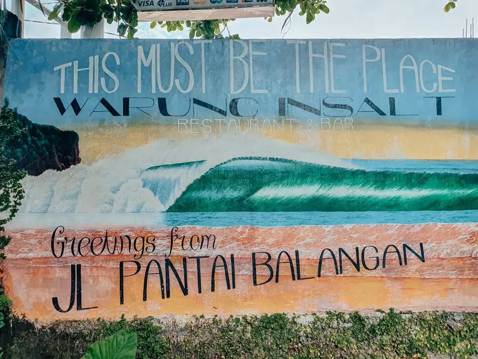 The painted Warung In Salt sign on Jalan Pantai Balangan