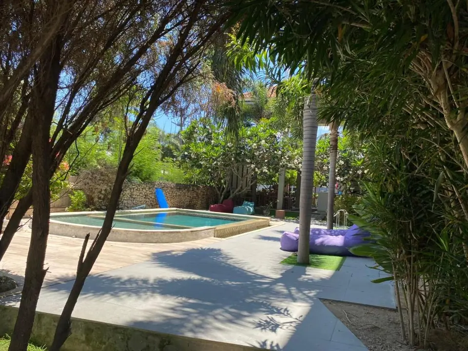 The shaded pool and garden at KutaBay Homestay in Lombok